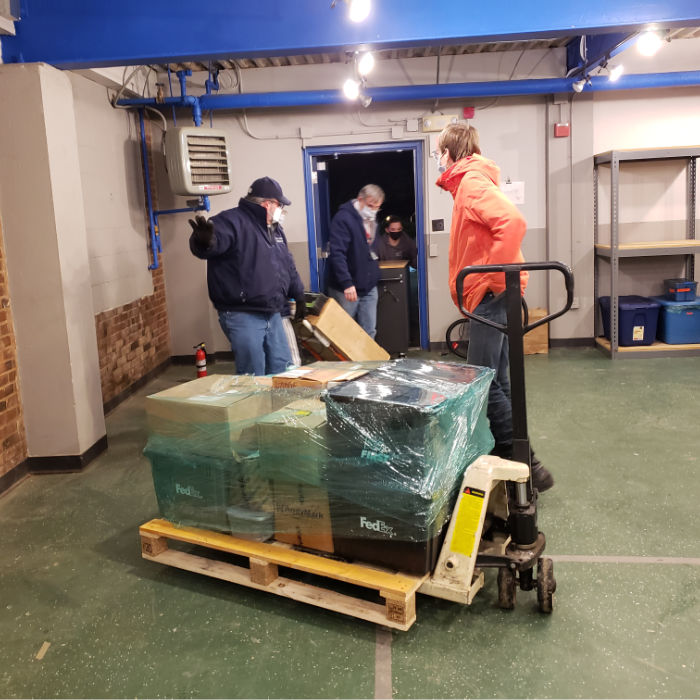 moving pallet of boxes into new shop space