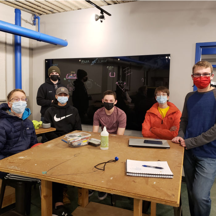 first meeting in new space, students around a table