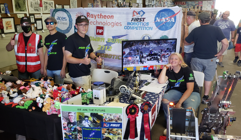 4 team members at the team's booth at the Bethlehem Fair