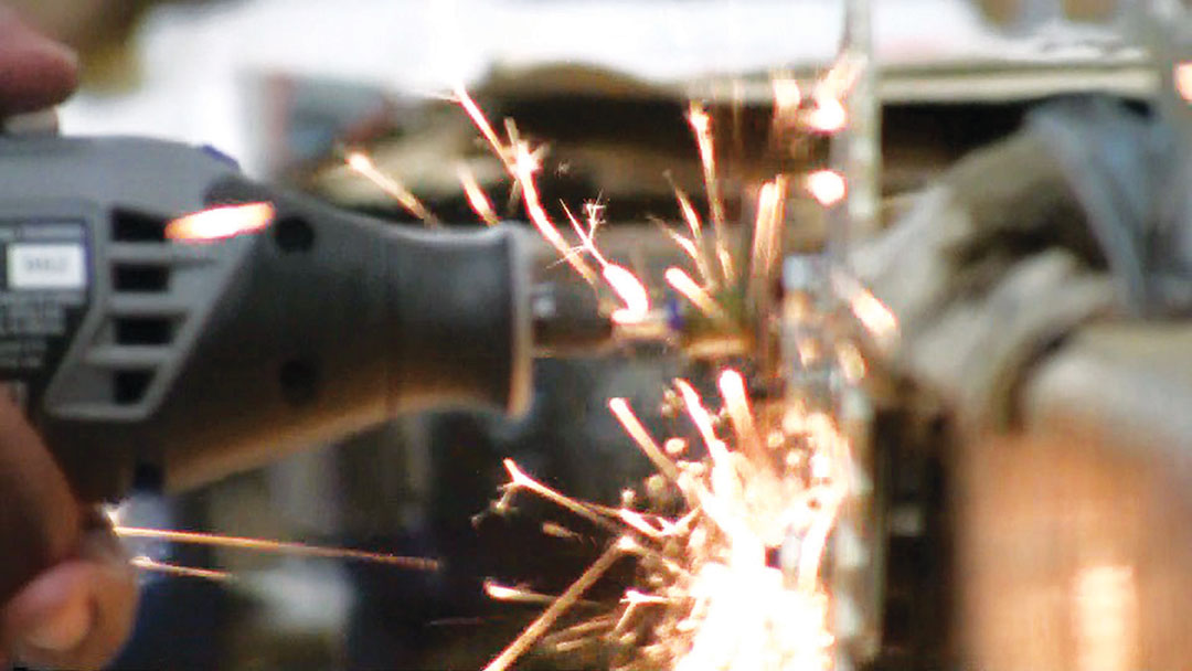 sparks flying off a tool grinding metal