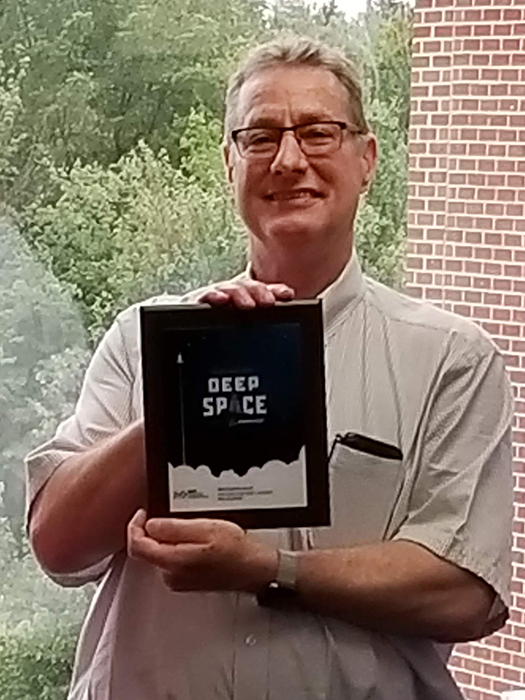 Tom Ordway with award plaque