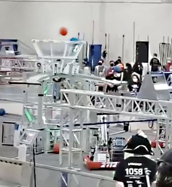 team robot on the competition field shooting ball into goal