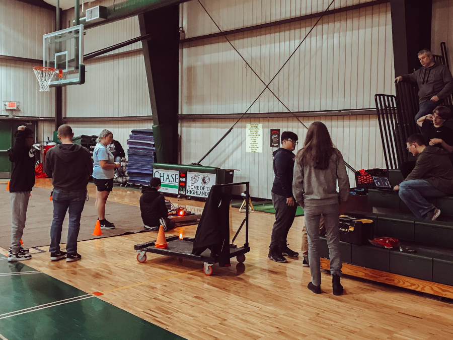 students with the robot in the gym, ready for a test run