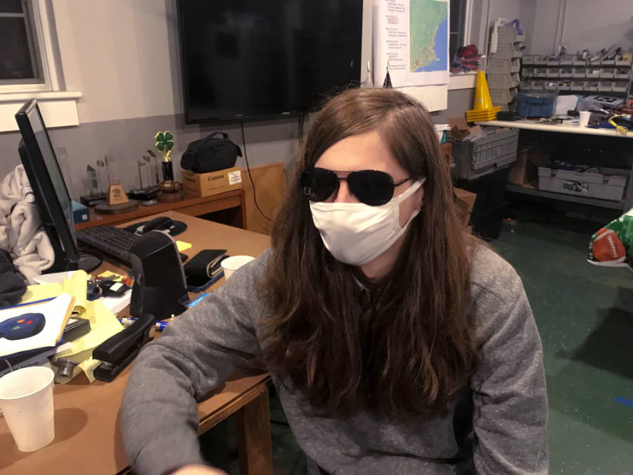 masked student in shop wearing sunglasses