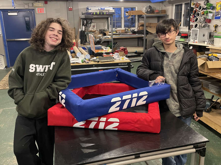 Two students posing with finished bumpers